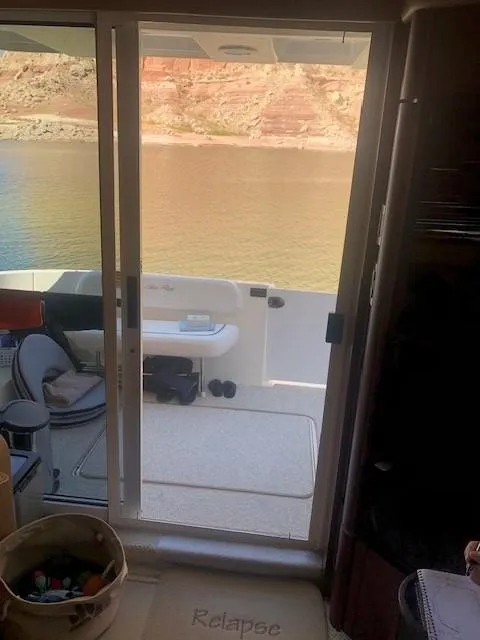 Slide: The Image of Interior view of 2007 Sea Ray 36 Sedan Bridge yacht with sliding door to deck. - 13