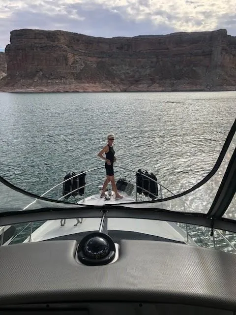 Slide: The Image of Person standing on the bow of a 2007 Sea Ray 36 Sedan Bridge yacht. - 14