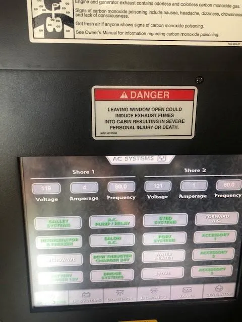 Slide: The Image of Control panel of a 2007 Sea Ray 36 Sedan Bridge boat with warning labels. - 15