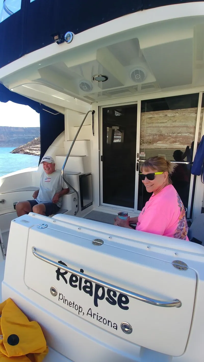 Slide: The Image of Two people relaxing on a 2007 Sea Ray 36 Sedan Bridge yacht named Relapse. - 21