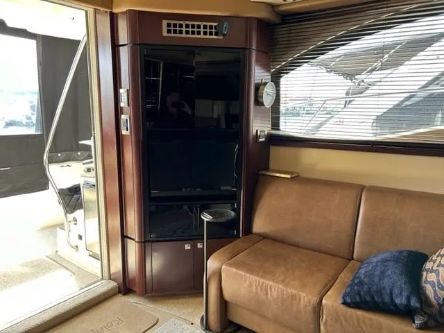 Slide: The Image of Interior of 2007 Sea Ray 36 Sedan Bridge with sofa and entertainment center. - 27