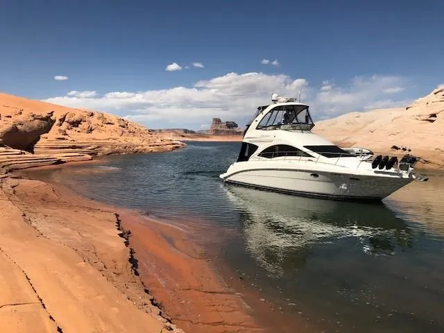 Slide: The Image of 2007 Sea Ray 36 Sedan Bridge yacht cruising through a scenic canyon waterway. - 8