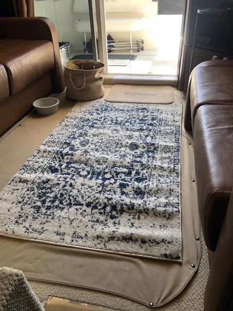 Slide: The Image of Interior of 2007 Sea Ray 36 Sedan Bridge with patterned rug and leather seating. - 9