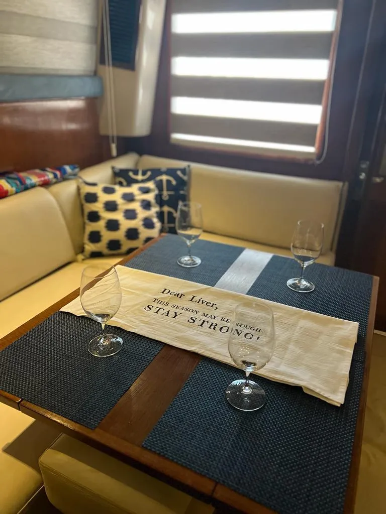 Slide: The Image of Interior of 1994 Luhrs 380 Tournament yacht with dining table and nautical decor. - 12