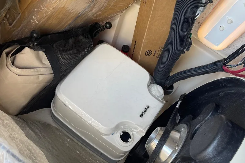 Slide: The Image of 2023 Sea Chaser 22 HFC boat interior storage compartment with equipment. - 4