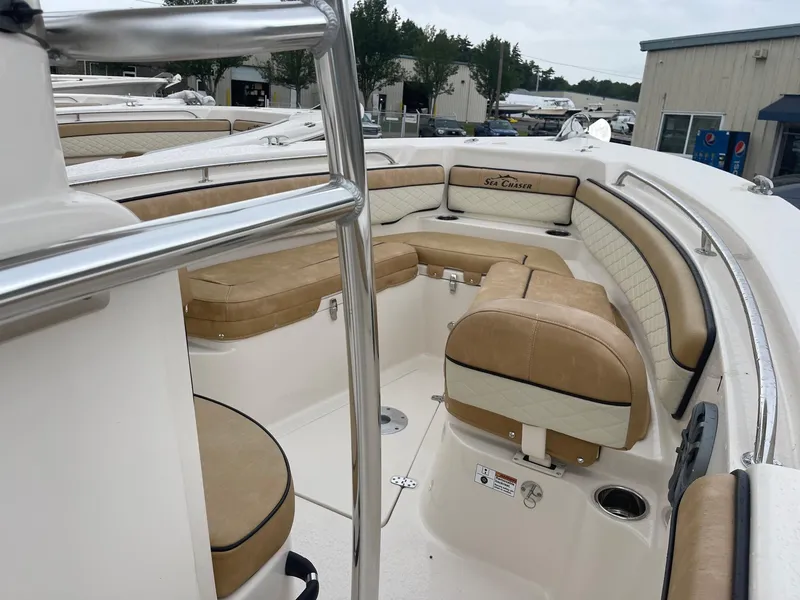 Slide: The Image of 2023 Sea Chaser 22 HFC boat interior with tan cushioned seating. - 6