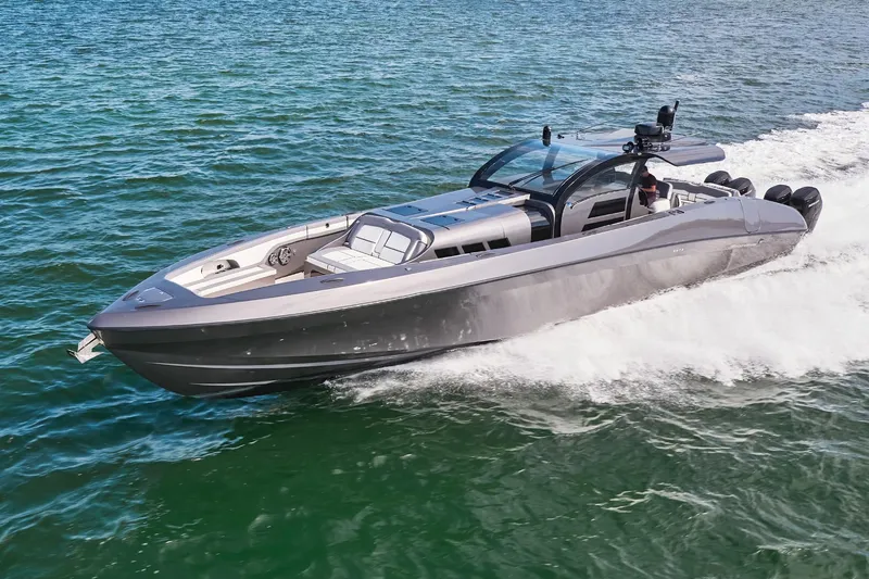 The Image of 2019 Midnight Express 60' Pied-A-Mer luxury speedboat cruising on open water. - 0
