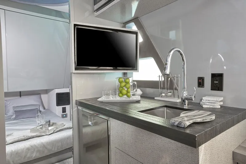 Slide: The Image of Modern kitchen and bedroom interior of 2019 Midnight Express 60' Pied-A-Mer yacht. - 15