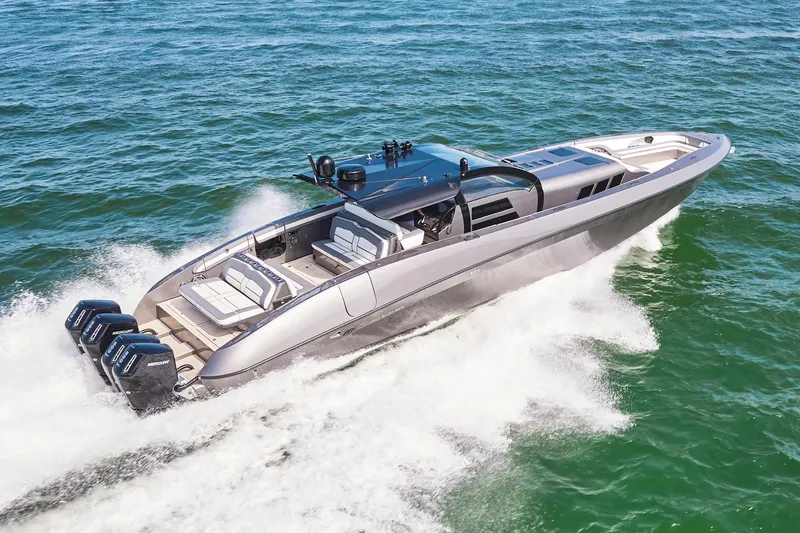 Slide: The Image of 2019 Midnight Express 60' Pied-A-Mer luxury boat cruising on the ocean. - 2
