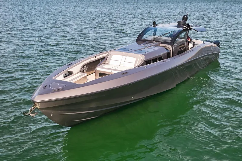 Slide: The Image of 2019 Midnight Express 60' Pied-A-Mer luxury yacht on calm waters. - 5