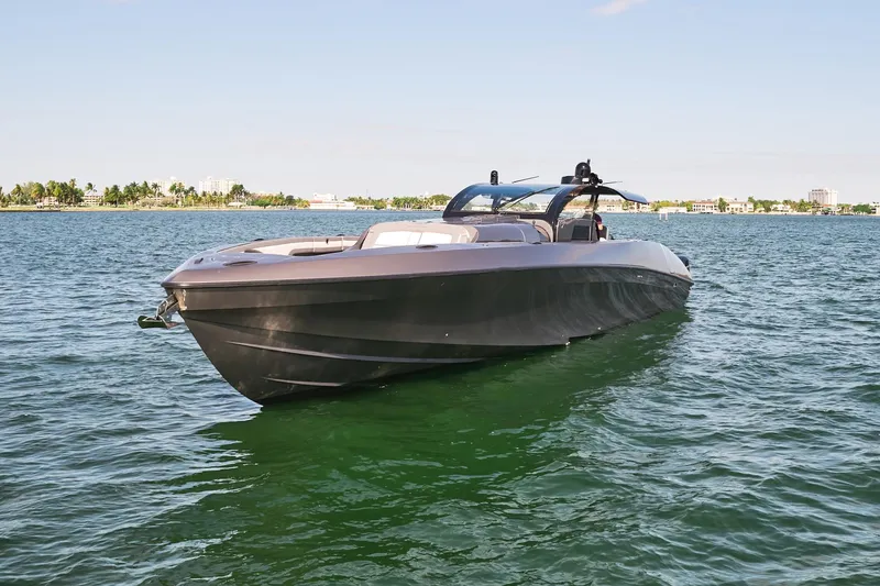 Slide: The Image of 2019 Midnight Express 60' Pied-A-Mer luxury boat on calm waters. - 6