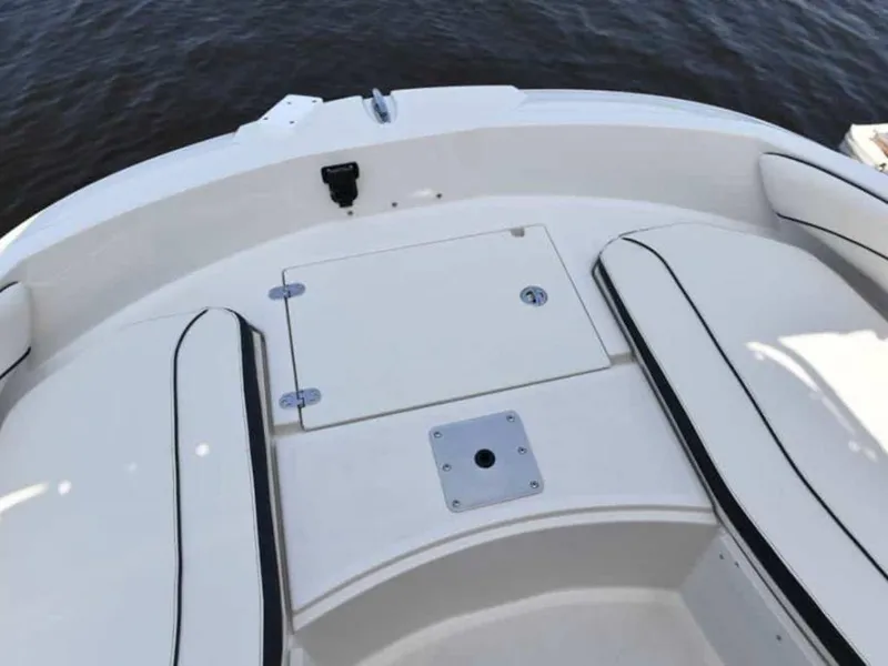 Slide: The Image of 2023 Stingray 206cc boat interior with seating and storage compartment. - 7