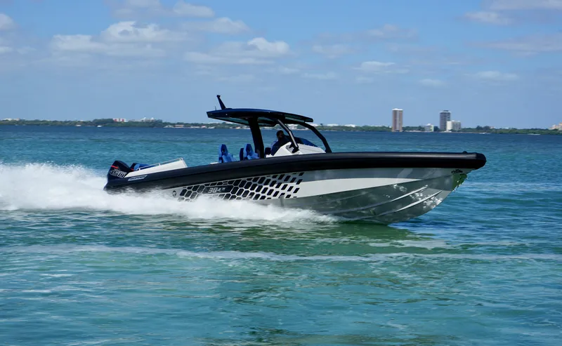 The Image of 2024 Skipper-BSK 38 speedboat cruising on clear blue water. - 0