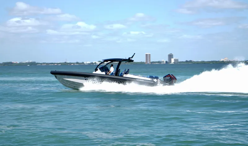 Slide: The Image of Skipper-BSK 38 boat speeding on water, 2024 model. - 11