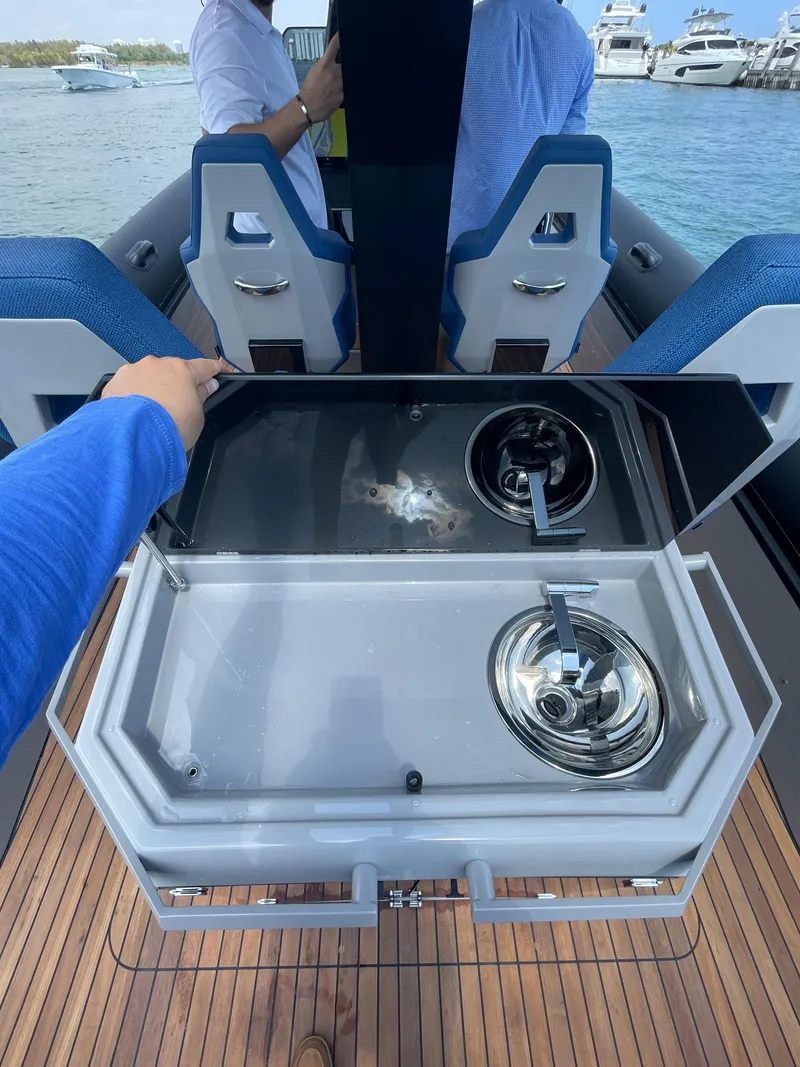 Slide: The Image of 2024 Skipper-BSK 38 boat interior with kitchenette and seating area. - 18