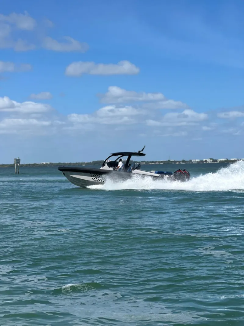 Slide: The Image of 2024 Skipper-BSK 38 speedboat cruising on a sunny day. - 9