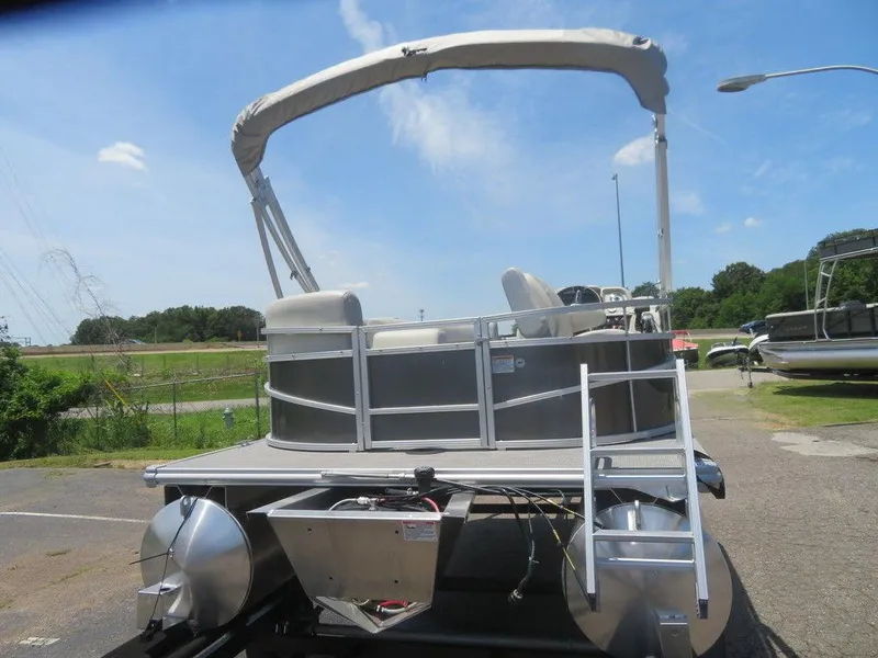 Slide: The Image of 2023 Starcraft LX 16 R pontoon boat with canopy, rear view. - 3