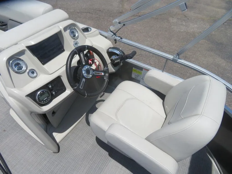 Slide: The Image of 2023 Starcraft LX 16 R boat cockpit with steering wheel and control panel. - 5