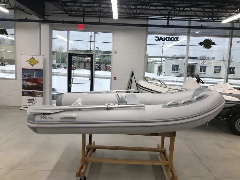 The Image of 2023 Zodiac Cadet 300 RIB ALU PVC inflatable boat displayed indoors. - 0
