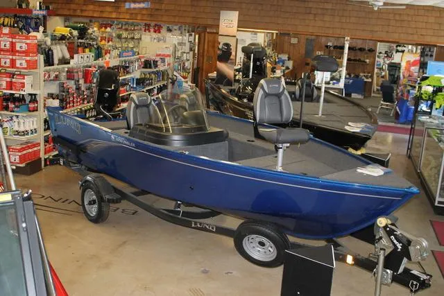 Slide: The Image of 2023 Lund 1650 Angler SS fishing boat, top view, red and gray color scheme. - 1
