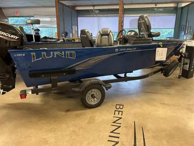 Slide: The Image of 2023 Lund 1650 Angler SS fishing boat, top view, red and gray interior. - 2