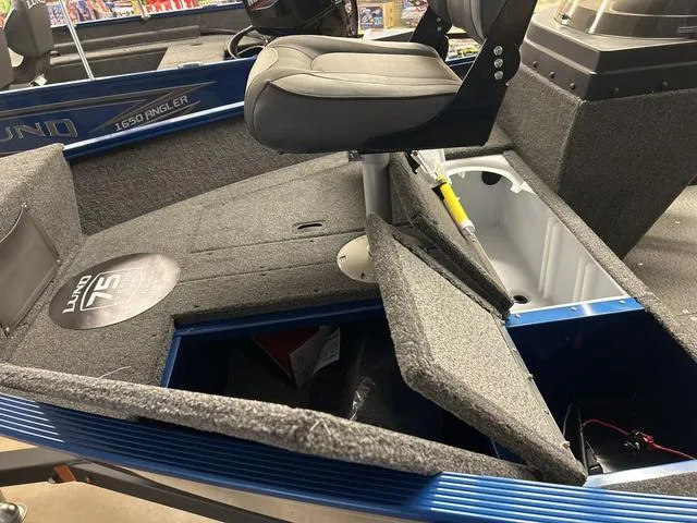 Slide: The Image of 2023 Lund 1650 Angler SS boat dashboard with steering wheel and instrument panel. - 5