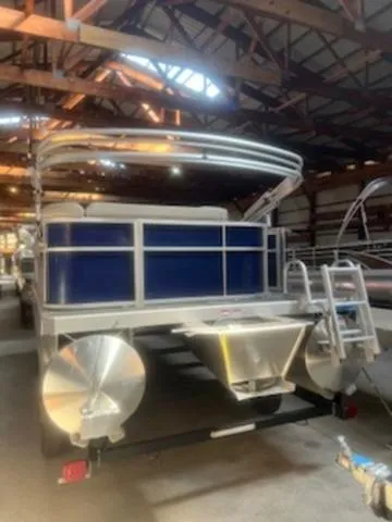Slide: The Image of 2023 Bennington 22 SL pontoon boat interior with seating and steering console. - 4
