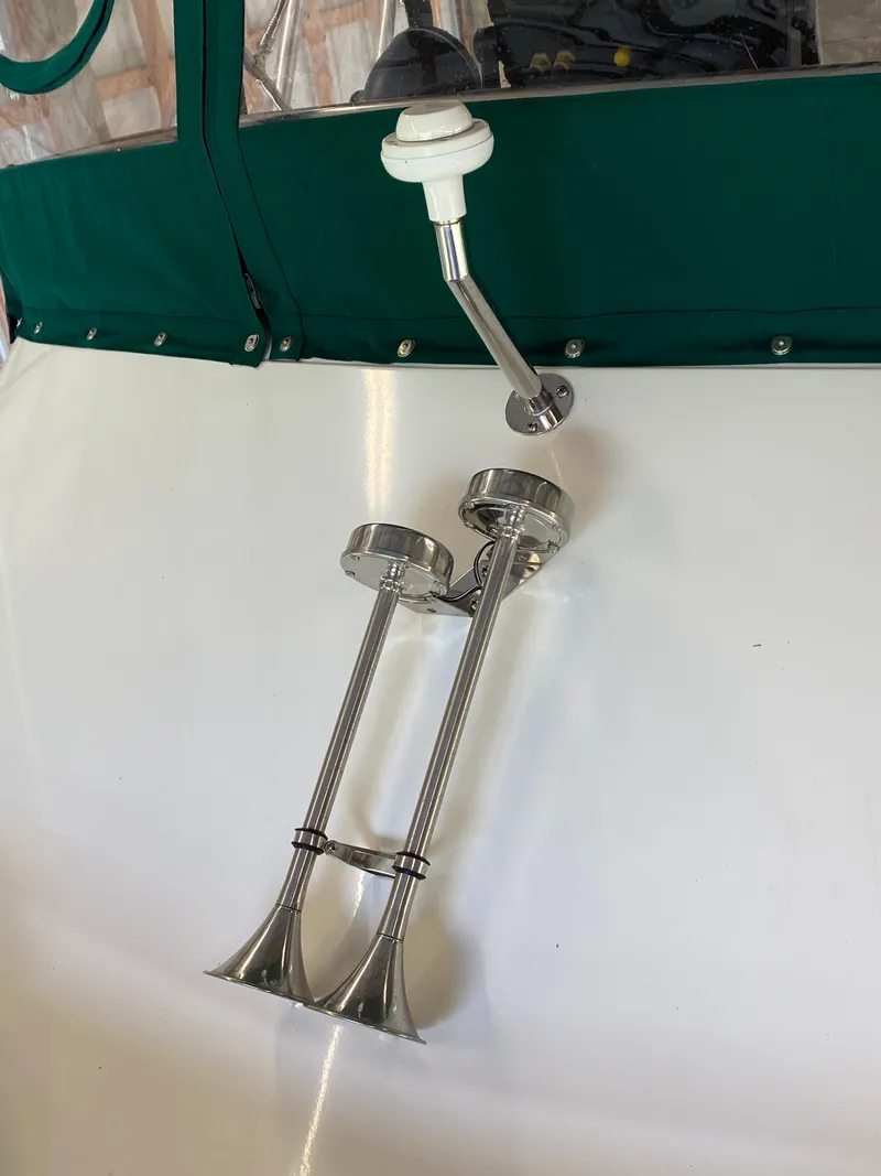 Slide: The Image of 1988 Blackfin 29 Flybridge boat horn and antenna on deck. - 14