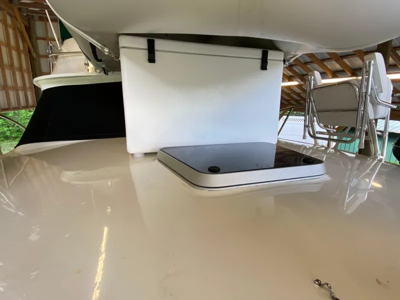 Slide: The Image of 1988 Blackfin 29 Flybridge boat interior with seating and storage area. - 17