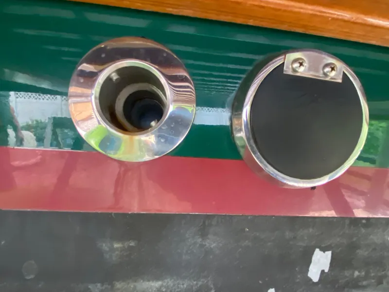 Slide: The Image of Fuel and water fill ports on a 1988 Blackfin 29 Flybridge boat. - 26