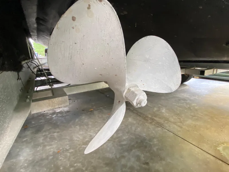 Slide: The Image of Propeller of a 1988 Blackfin 29 Flybridge boat in a dry dock setting. - 29