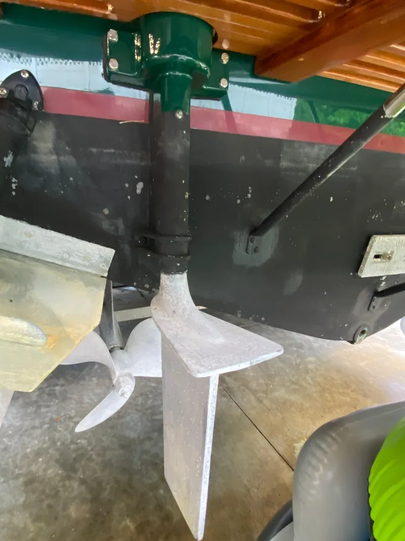 Slide: The Image of 1988 Blackfin 29 Flybridge boat propeller and rudder detail in a garage setting. - 33