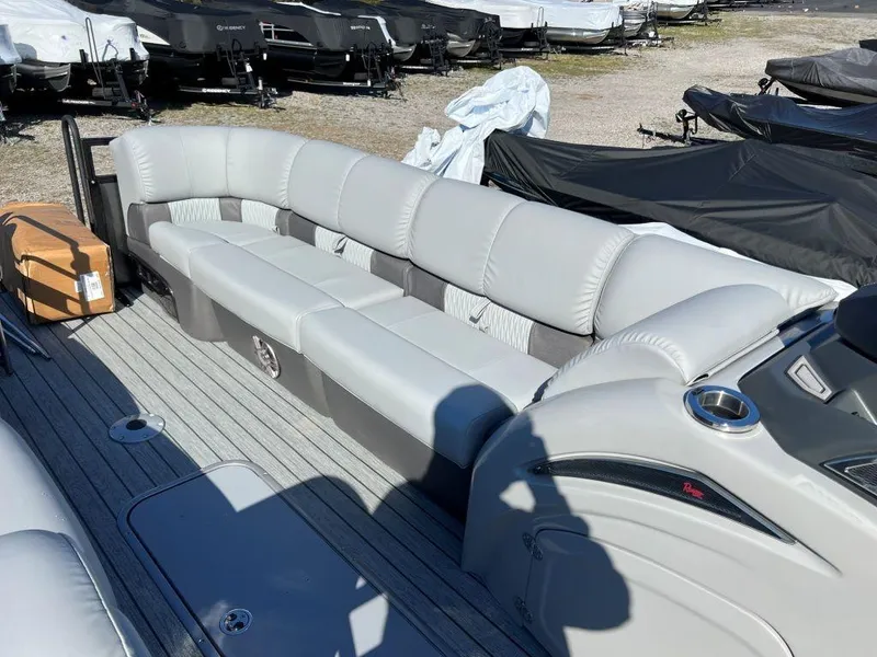 Slide: The Image of 2023 Ranger 2500LS pontoon boat with spacious seating and modern design. - 7