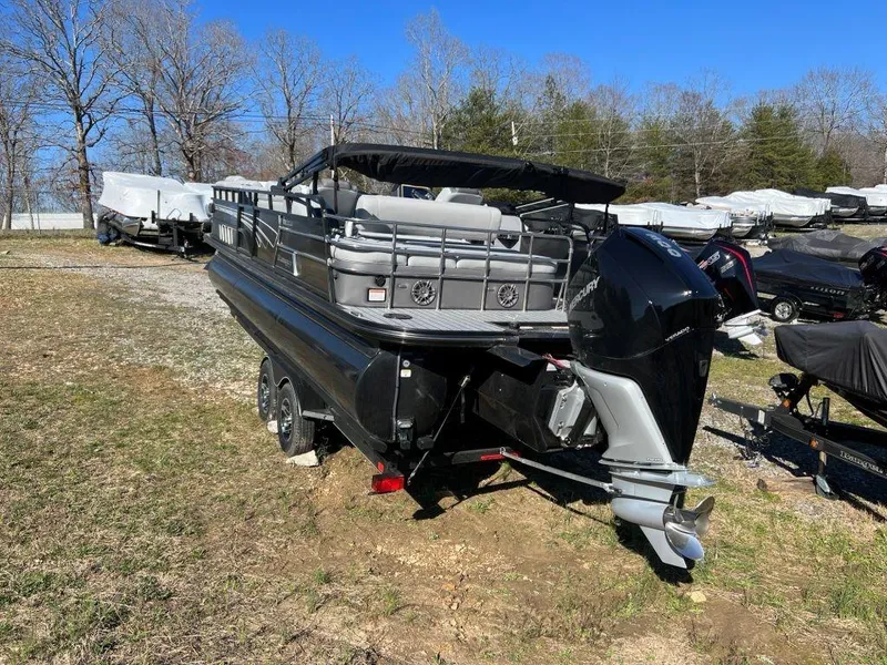 Slide: The Image of 2023 Ranger 2500LS pontoon boat on a trailer in a storage yard. - 8