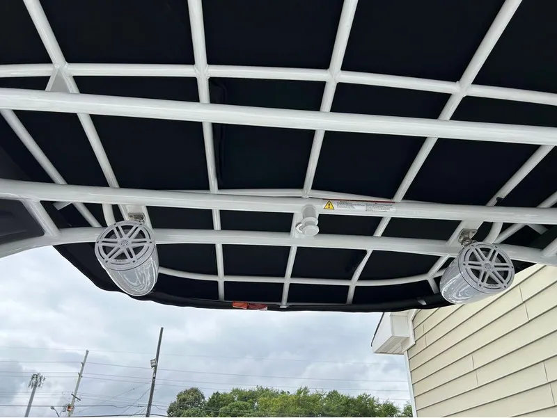 Slide: The Image of 2022 Monterey 298 Super Sport boat canopy with speakers, viewed from below. - 10