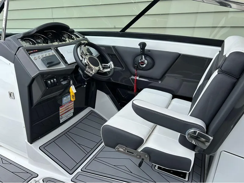 Slide: The Image of 2022 Monterey 298 Super Sport boat interior with modern dashboard and seating. - 12