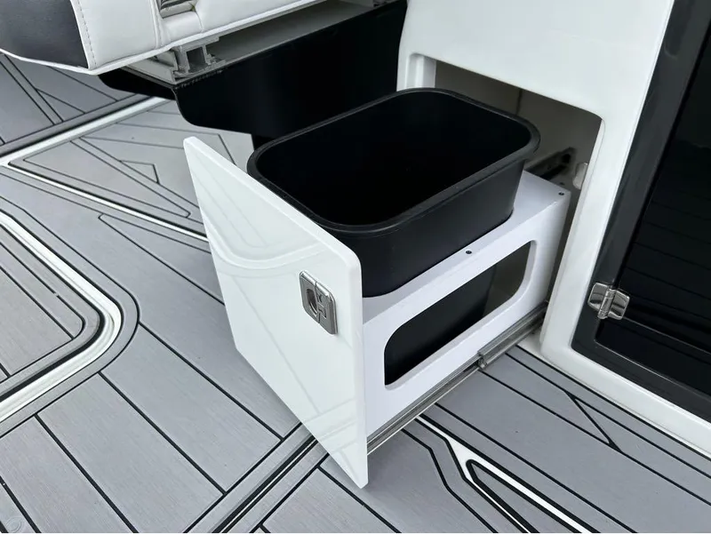 Slide: The Image of 2022 Monterey 298 Super Sport boat with pull-out storage compartment on deck. - 17