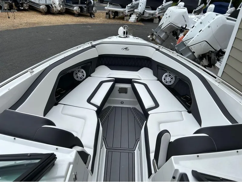 Slide: The Image of 2022 Monterey 298 Super Sport boat interior with sleek seating and modern design. - 18