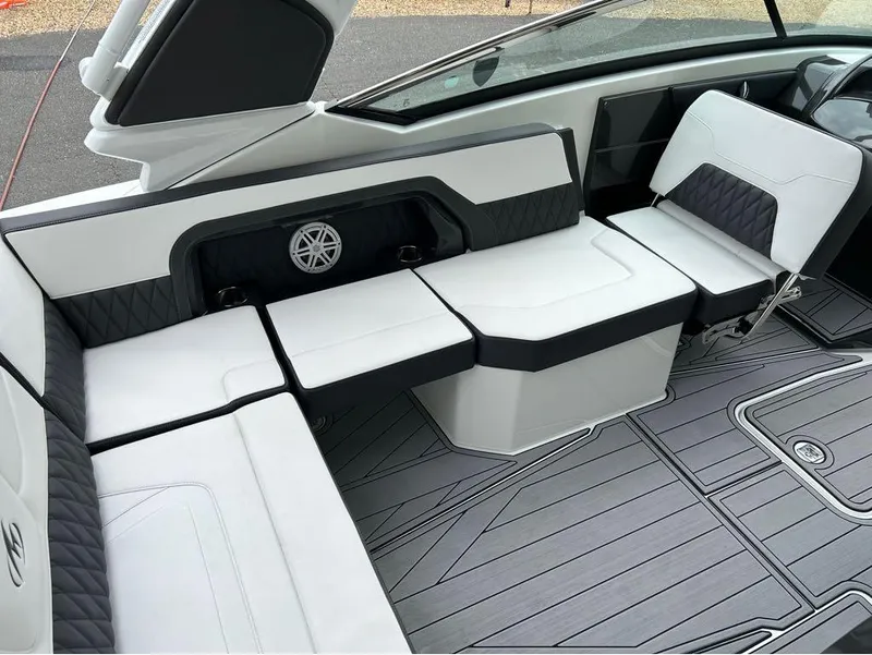 Slide: The Image of 2022 Monterey 298 Super Sport boat interior with sleek white and black seating. - 21
