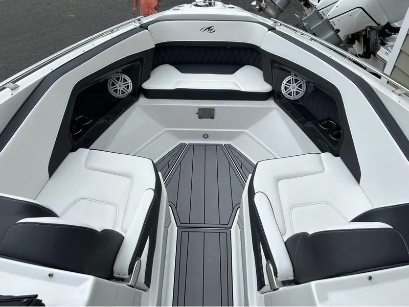 Slide: The Image of 2022 Monterey 298 Super Sport boat interior with white seating and modern design. - 22