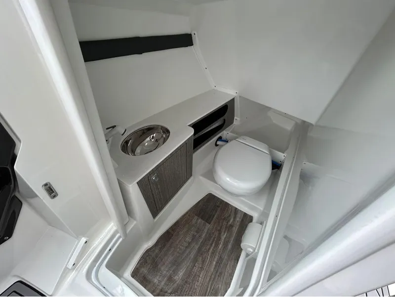 Slide: The Image of 2022 Monterey 298 Super Sport boat bathroom with sink and toilet. - 25