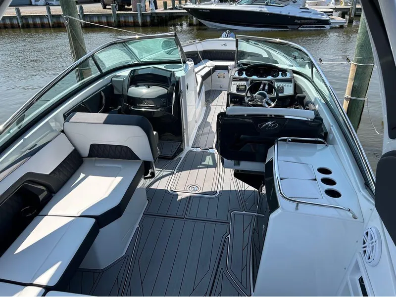 Slide: The Image of 2022 Monterey 298 Super Sport boat interior with sleek seating and modern dashboard. - 4
