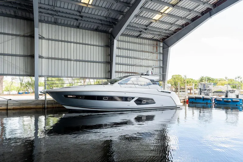 The Image of 2017 Azimut Atlantis 43 yacht docked in a covered marina. - 0