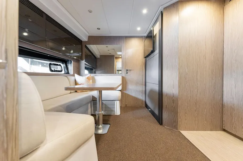 Slide: The Image of Interior of 2017 Azimut Atlantis 43 yacht with modern seating and wooden finishes. - 10