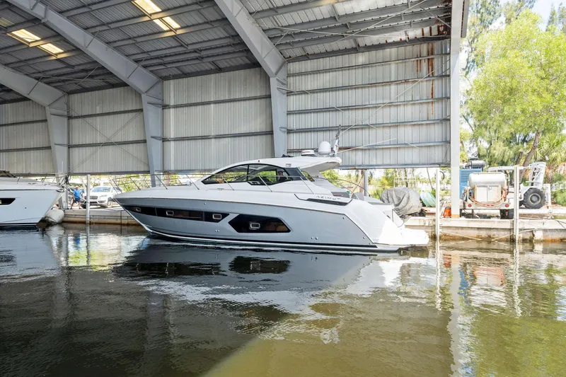 Slide: The Image of 2017 Azimut Atlantis 43 yacht docked in a covered marina. - 17