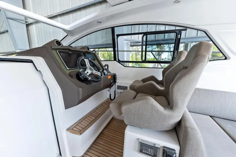 Slide: The Image of Interior helm of 2017 Azimut Atlantis 43 yacht with modern controls and comfortable seating. - 4