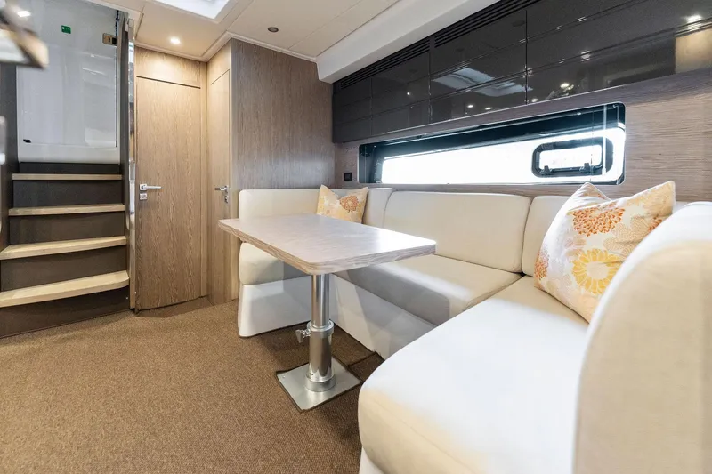 Slide: The Image of Interior of 2017 Azimut Atlantis 43 yacht with modern seating and dining area. - 8