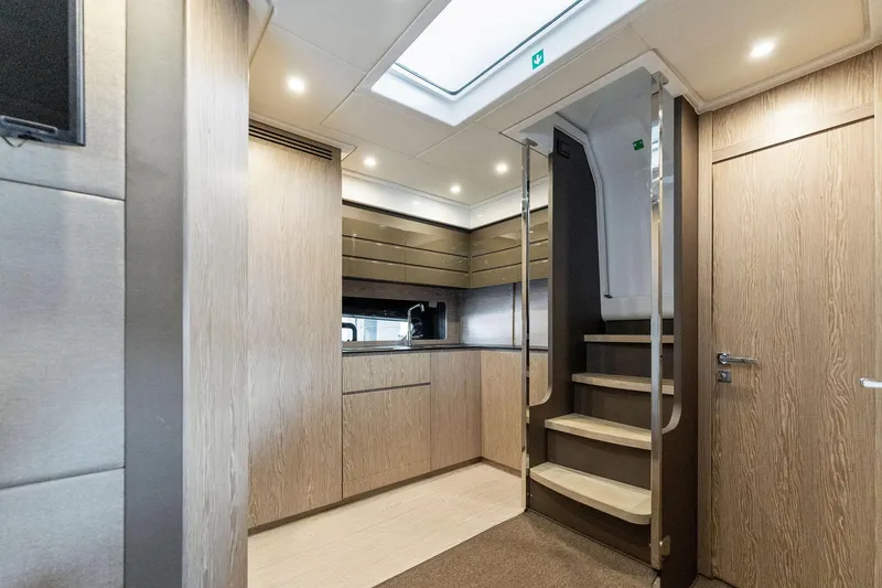 Slide: The Image of Modern interior of 2017 Azimut Atlantis 43 yacht with wooden cabinetry and stairs. - 9