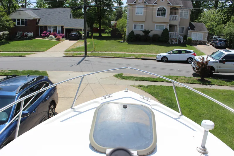 Slide: The Image of View from the bow of a 1996 Parker 2110 Walkaround boat in a suburban neighborhood. - 17