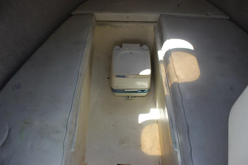 Slide: The Image of Interior cabin of a 1996 Parker 2110 Walkaround boat with portable toilet. - 22
